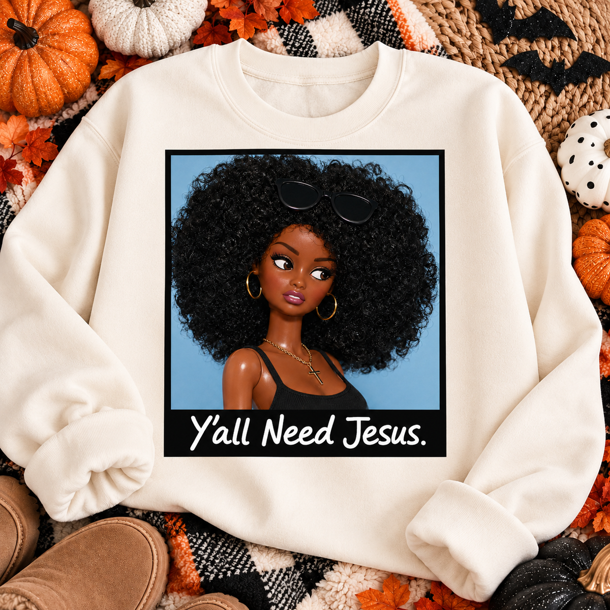 Y'all Need Jesus graphic on a crewneck sweatshirt fall flat lay