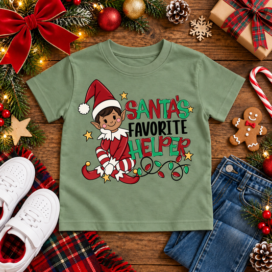 Santa's Favorite Helper Classic Red Elf – Warm Brown Skin Christmas T-shirt in Bay