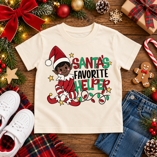 Santa's Favorite Helper Classic Red Elf – Deep Brown Skin Christmas T-shirt in Cream