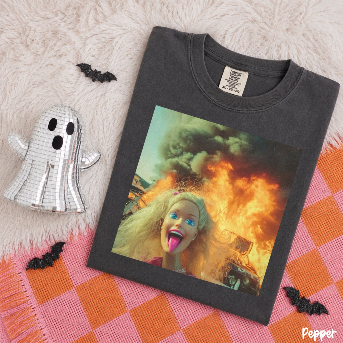 Comfort Colors Pepper T-shirt mockup featuring a blonde doll posing in front of flames