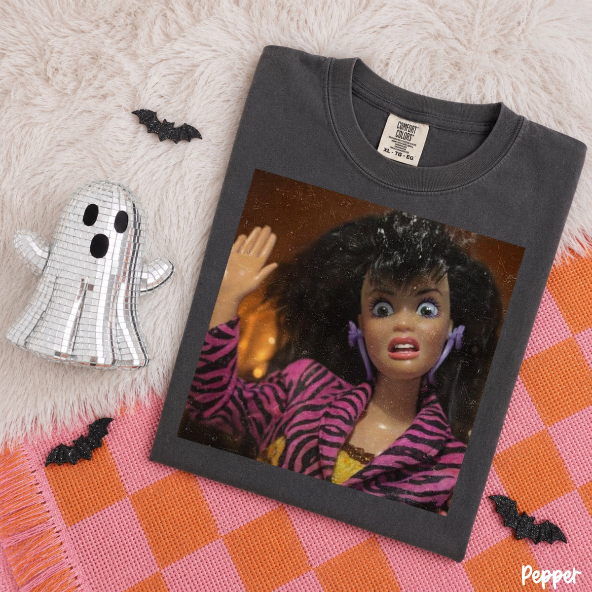 Comfort Colors Pepper T-shirt mockup featuring a shocked doll in a pink zebra jacket