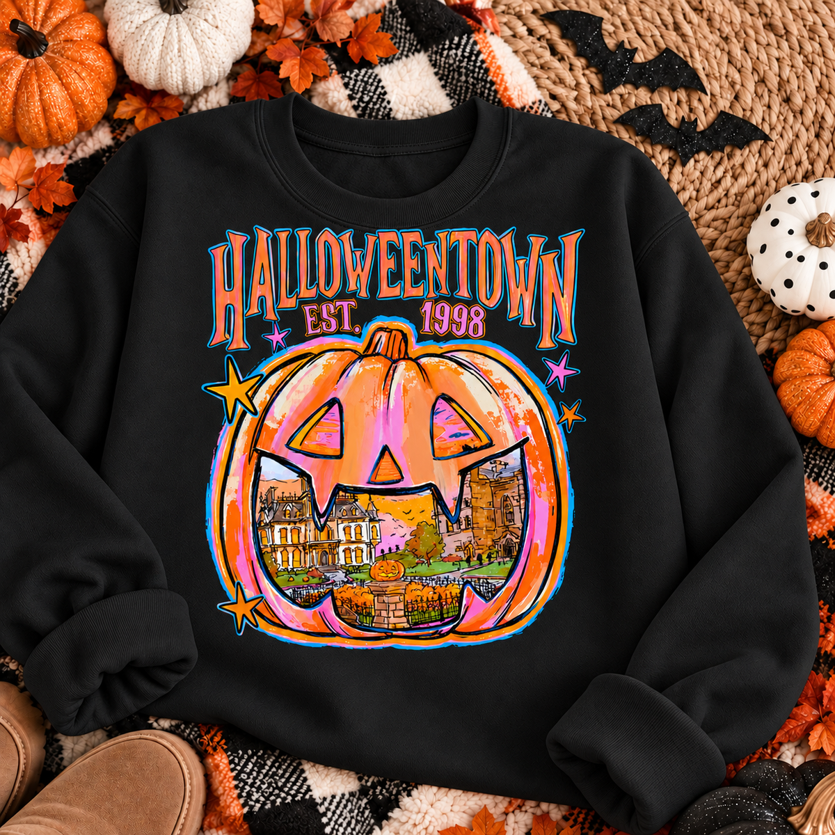 Halloweentown Est. 1998 on a black crewneck sweatshirt Halloween flat lay