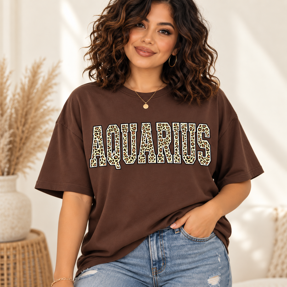 Aquarius leopard zodiac graphic tee modeled by a curly-haired Latina woman