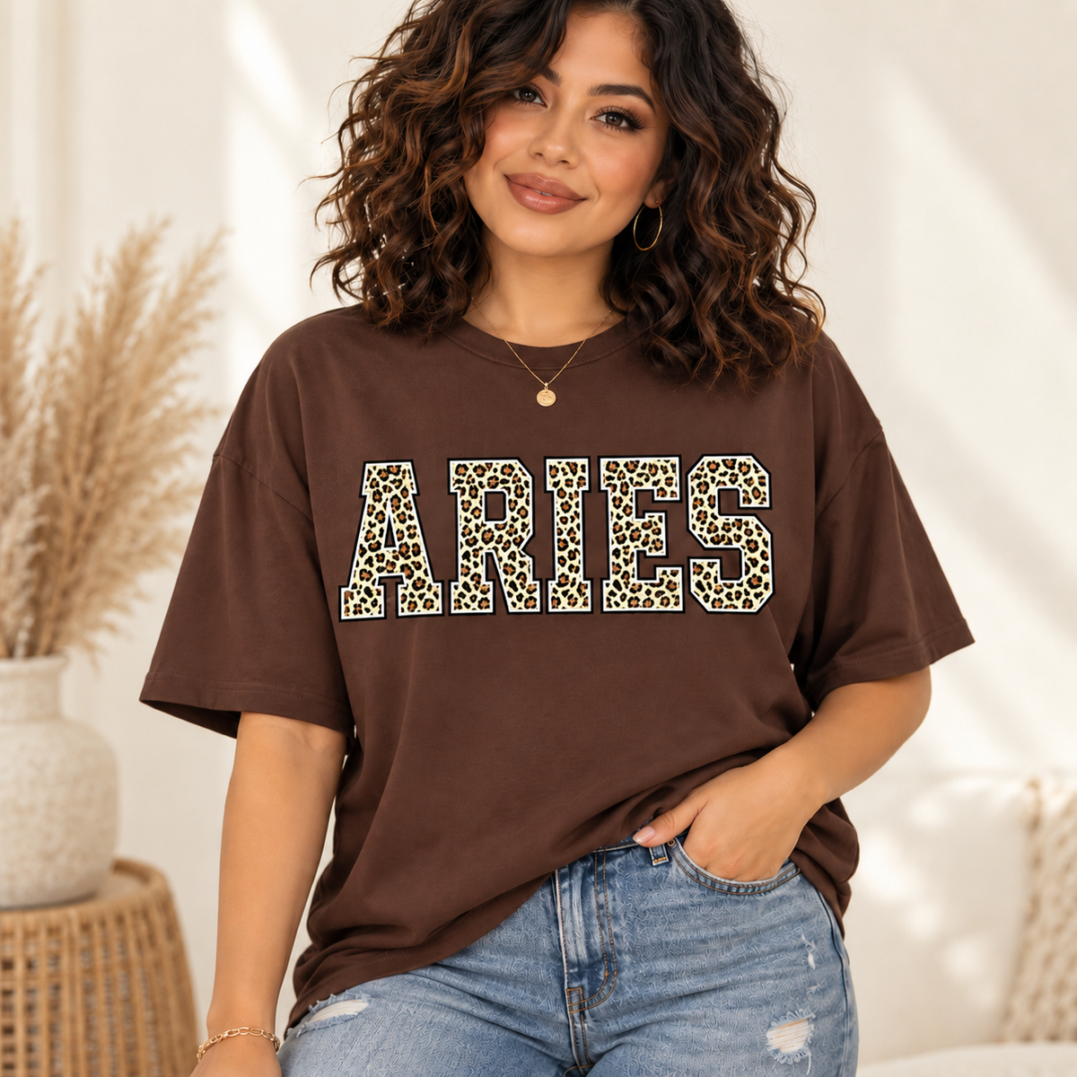 Aries leopard zodiac graphic tee modeled by a curly-haired Latina woman