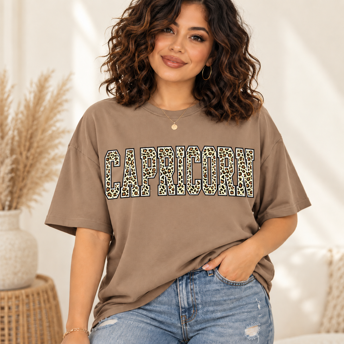 Capricorn leopard zodiac graphic tee modeled by a curly-haired Latina woman