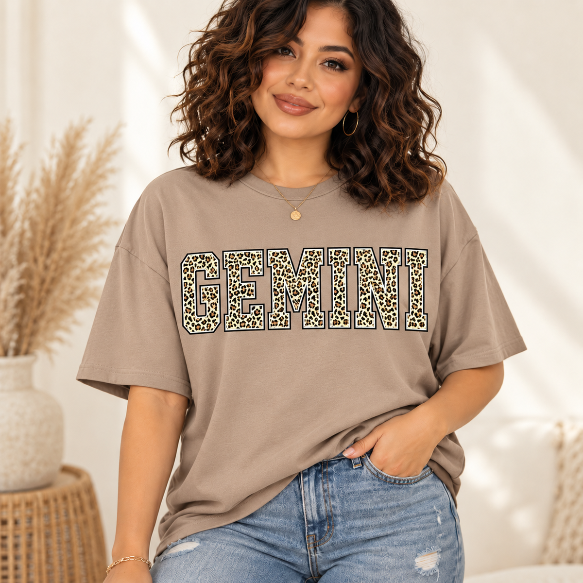 Gemini leopard zodiac graphic tee modeled by a curly-haired Latina woman