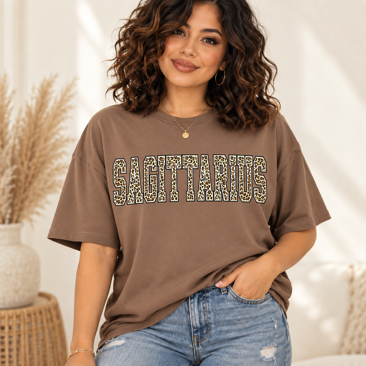 Sagittarius leopard zodiac graphic tee modeled by a curly-haired Latina woman