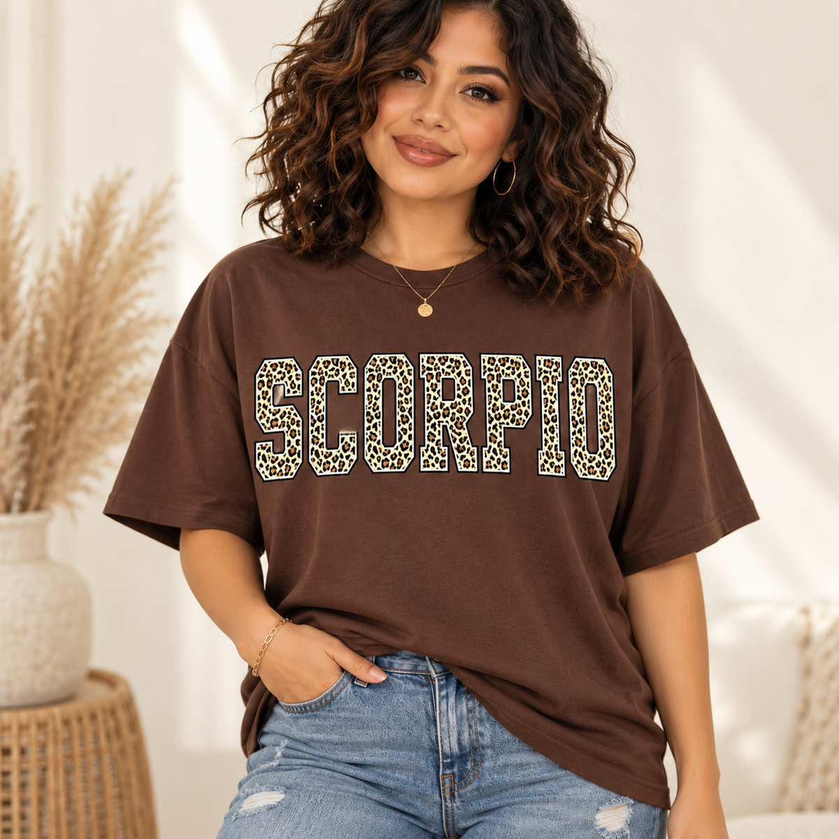 Scorpio leopard zodiac graphic tee modeled by a curly-haired Latina woman