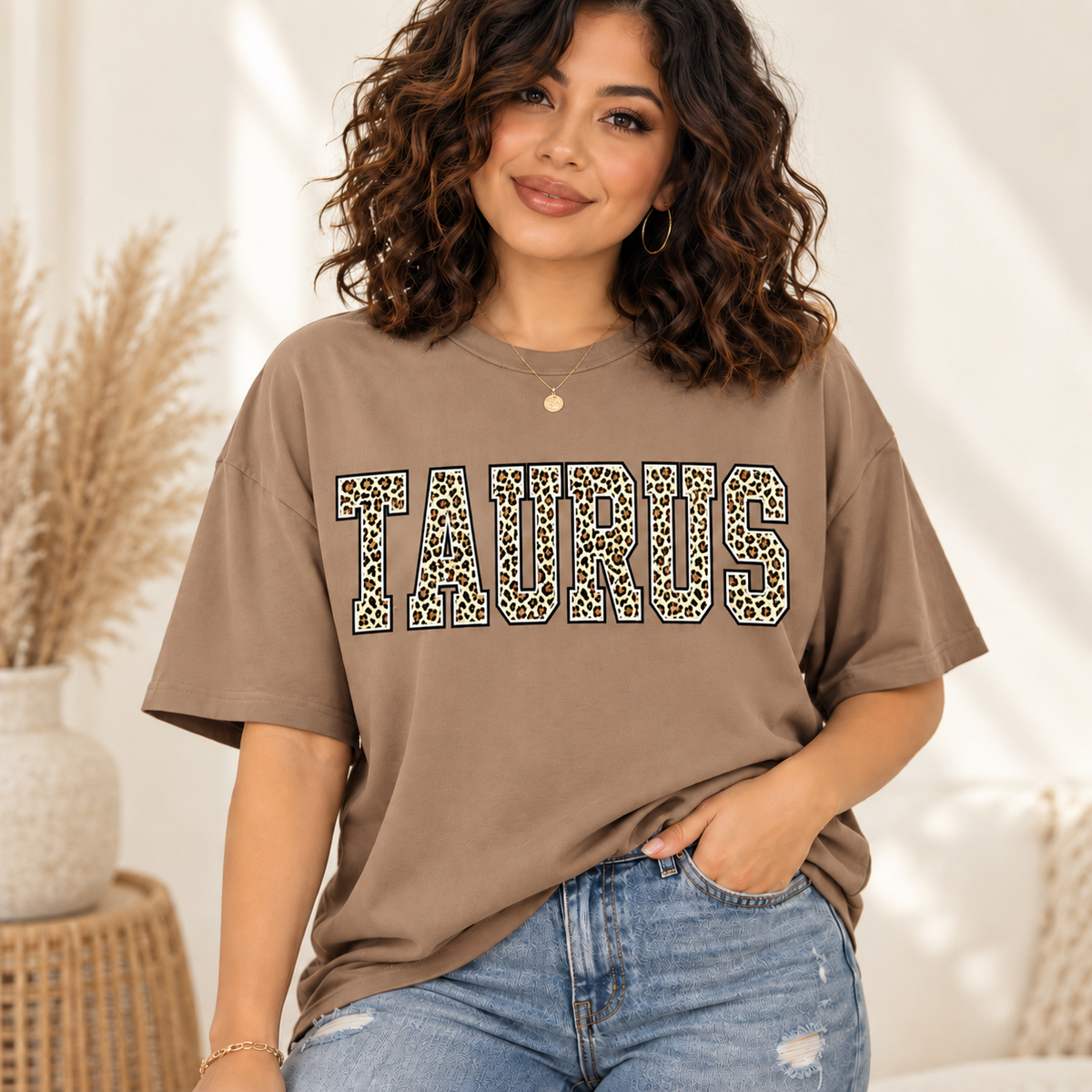 Taurus leopard zodiac graphic tee modeled by a curly-haired Latina woman
